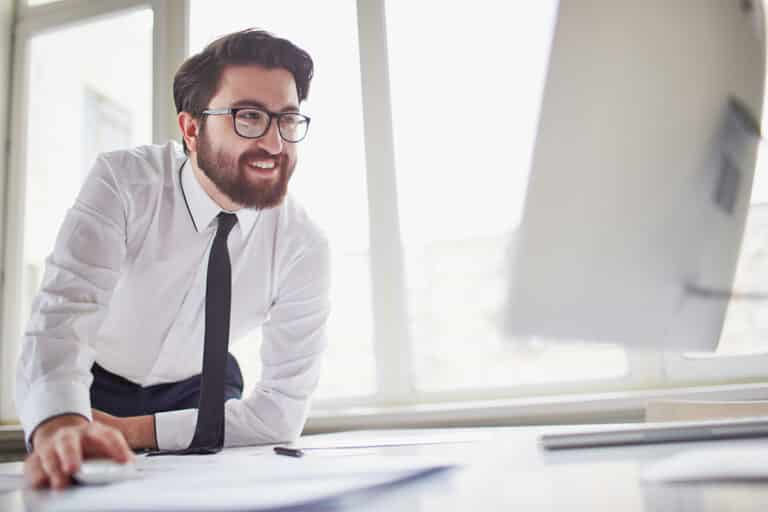 Successful businessman working with computer in office
