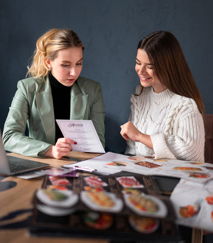 female wedding planner working with client